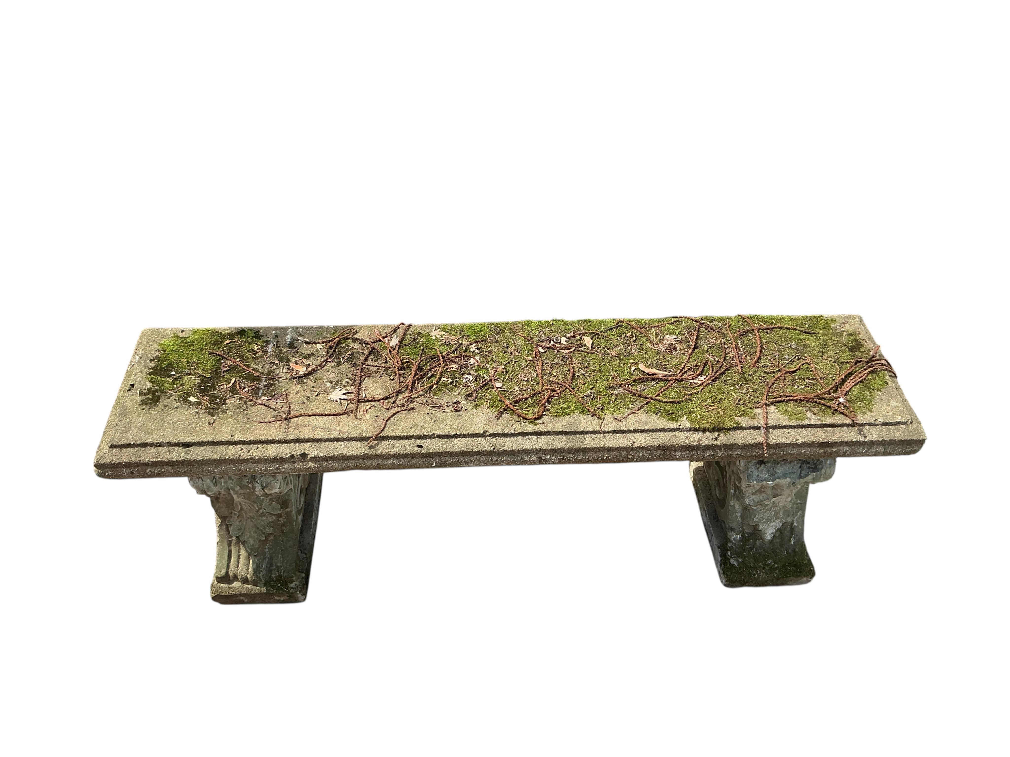 A rectangular reconstituted stone garden bench, width 142cm, height 42cm